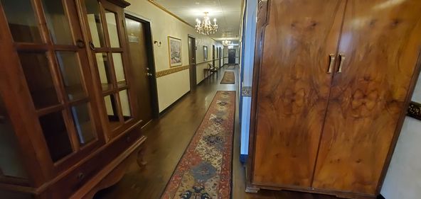 TILE ENTRY AND RECEPTION, 3 OFFICES AND LARGER ROOM.